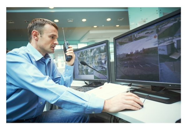 Security guard watching monitors for activity