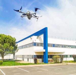 Drone Hovering in Building Parking Lot