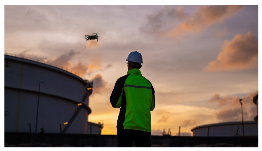 Drone Operator Patrolling Gas-Oil Refinery 