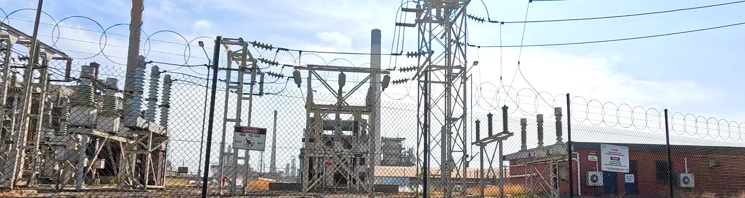 Electrical Substation Behind Fence
