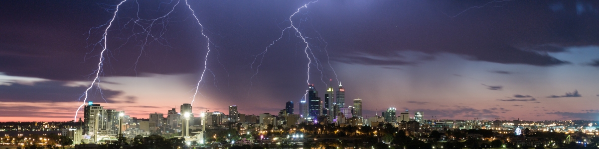 Lightning strikes above a city Lightning strikes above a city