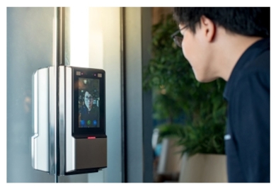 Man looking into a facial recognition device 