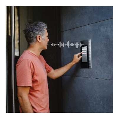 Man using an intercom system