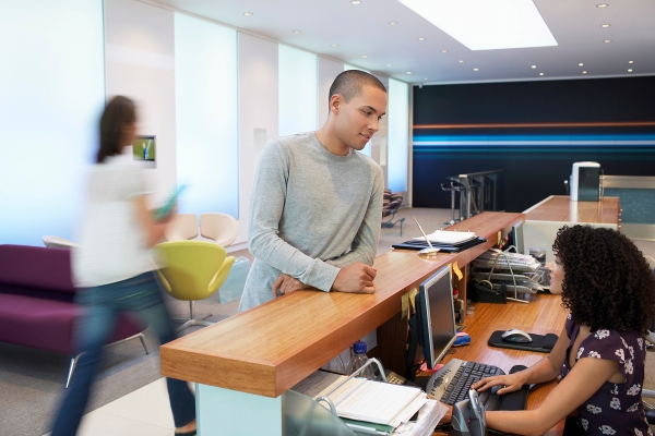 Office reception desk with patient checking in