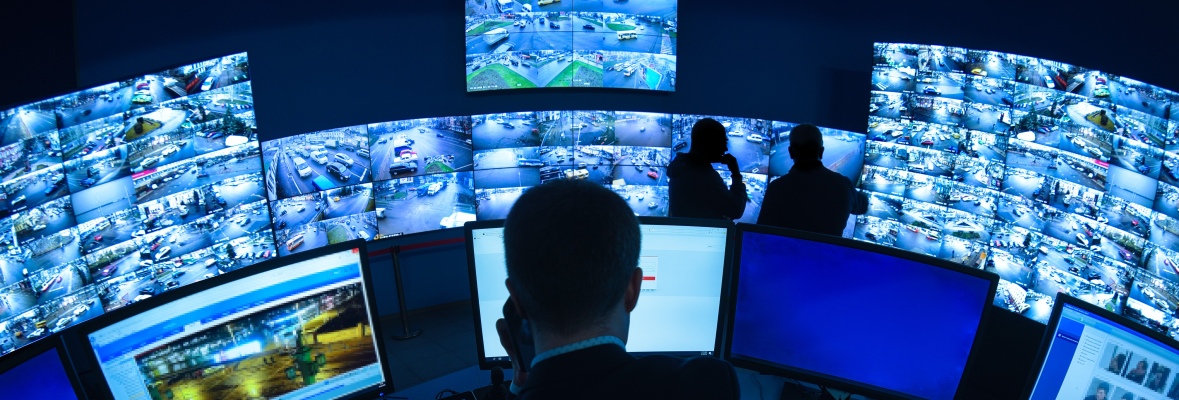 Surveillance Room with Monitors and Staff