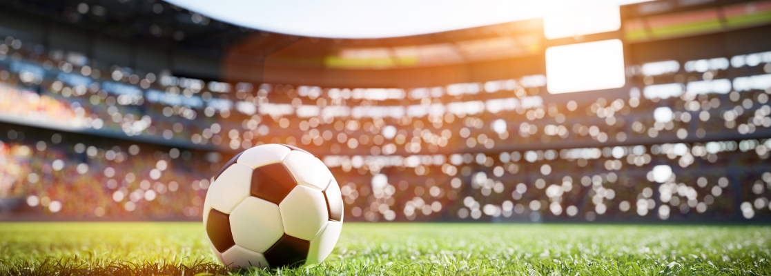 Soccer ball on grass within the stadium