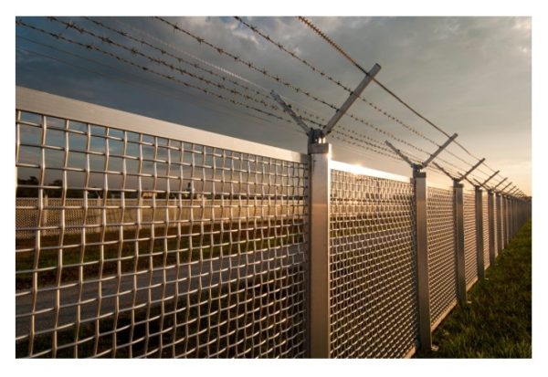 Two Layers of Fencing with Barbed Wire on Each