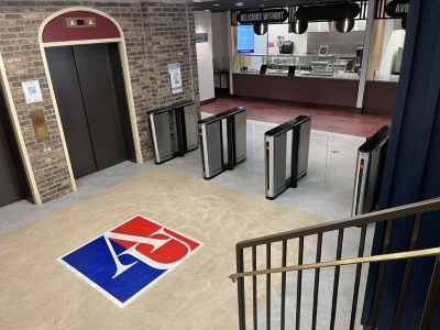 University cafeteria entrance with turnstiles