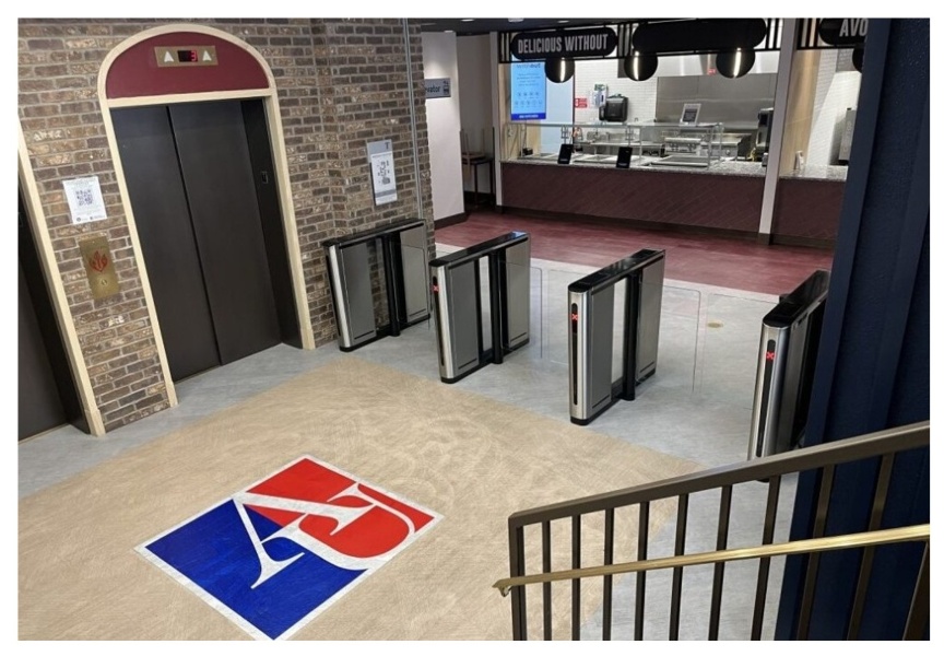 University cafeteria with turnstiles near entrance
