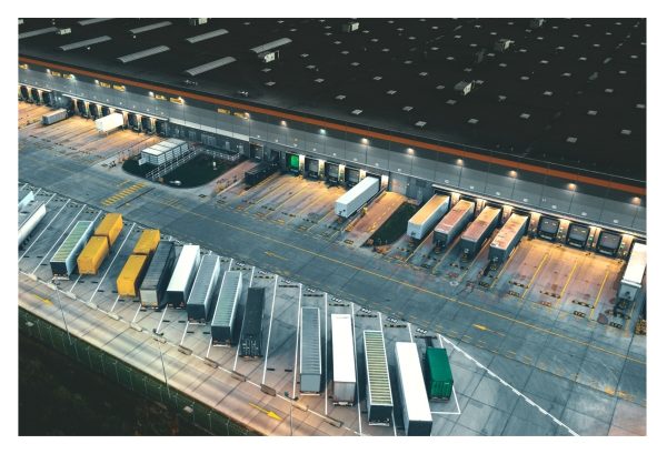 View of trailers and containers near a logistics warehouse