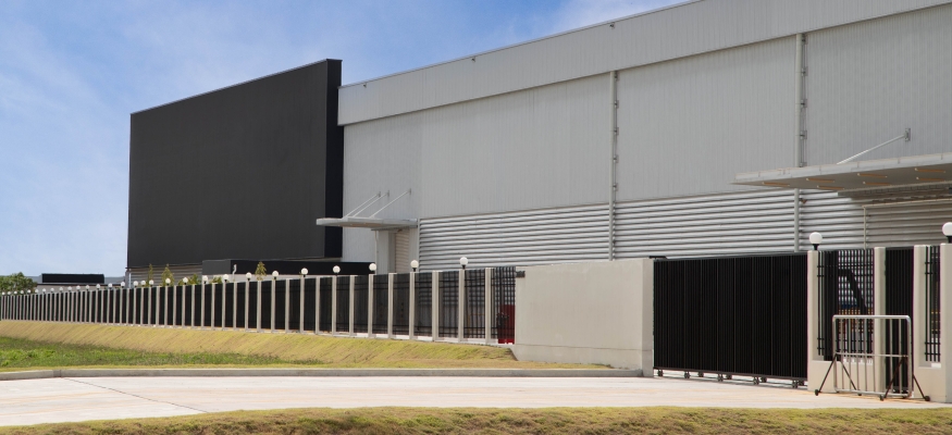 Warehouse with gate and fencing Warehouse with gate and fencing