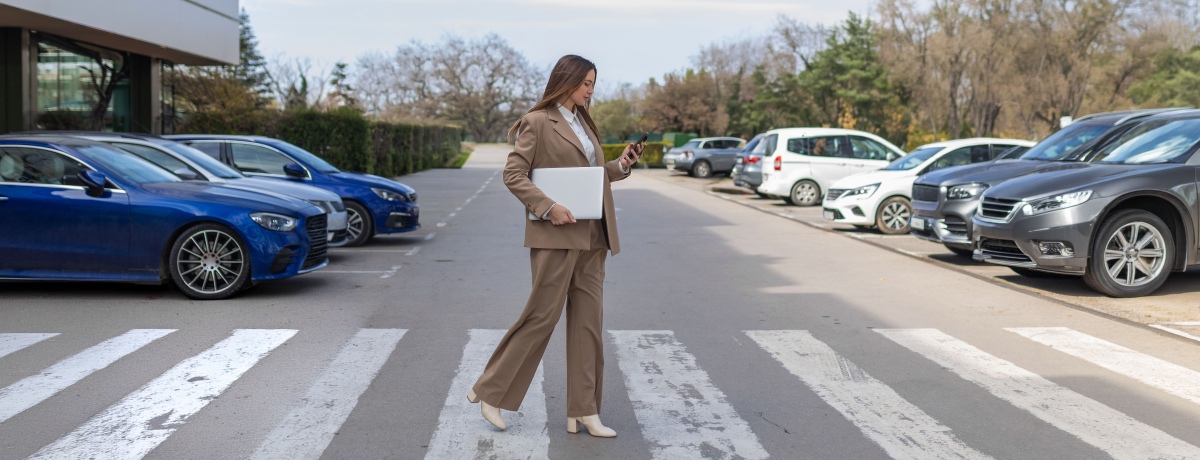 Woman in crosswalk on phone